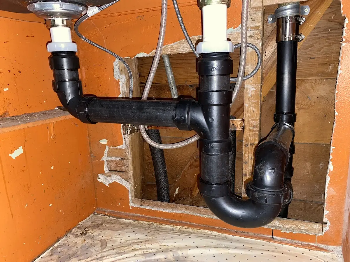Professional Garbage Disposal Repair equipment and tools on the job in Fayette